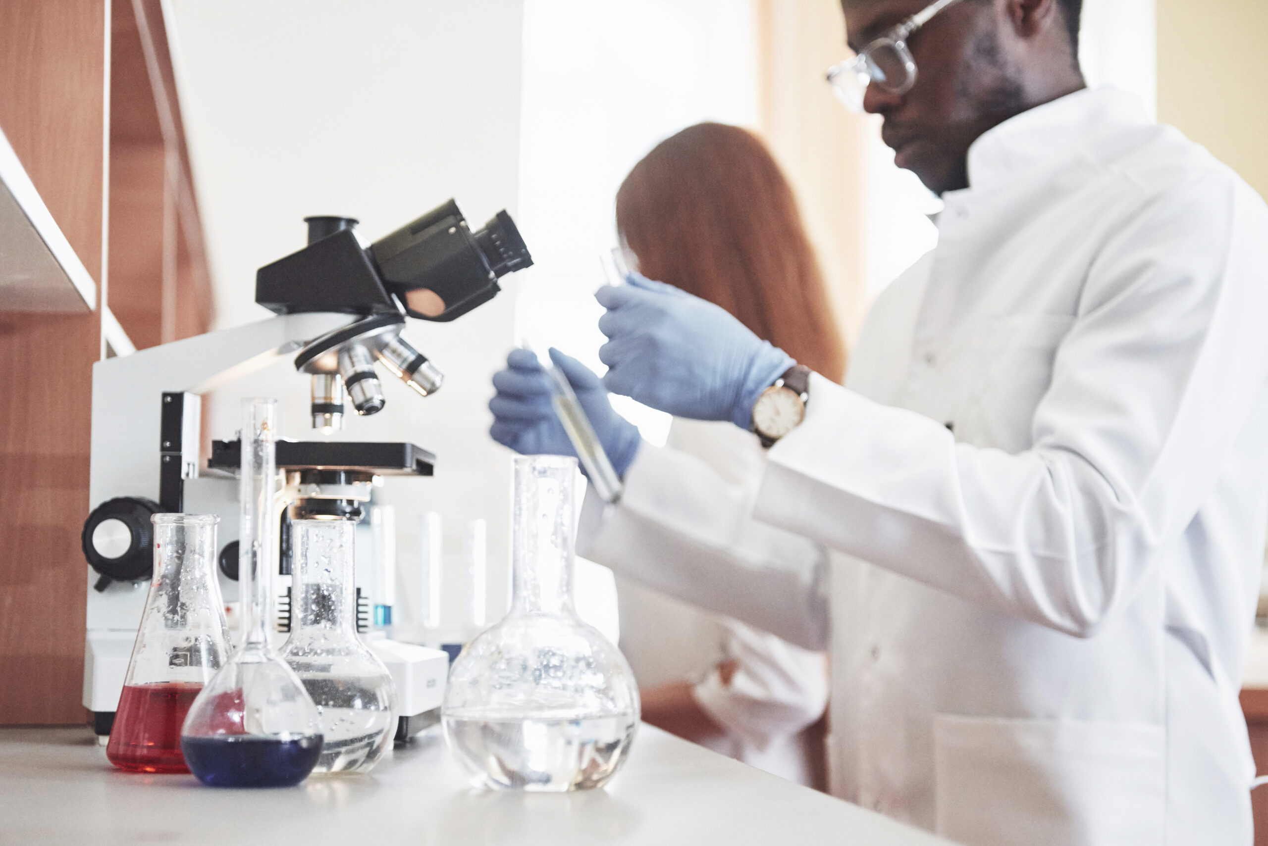 laboratory laboratories conduct experiments in a chemical laboratory in transparent flasks. output formulas